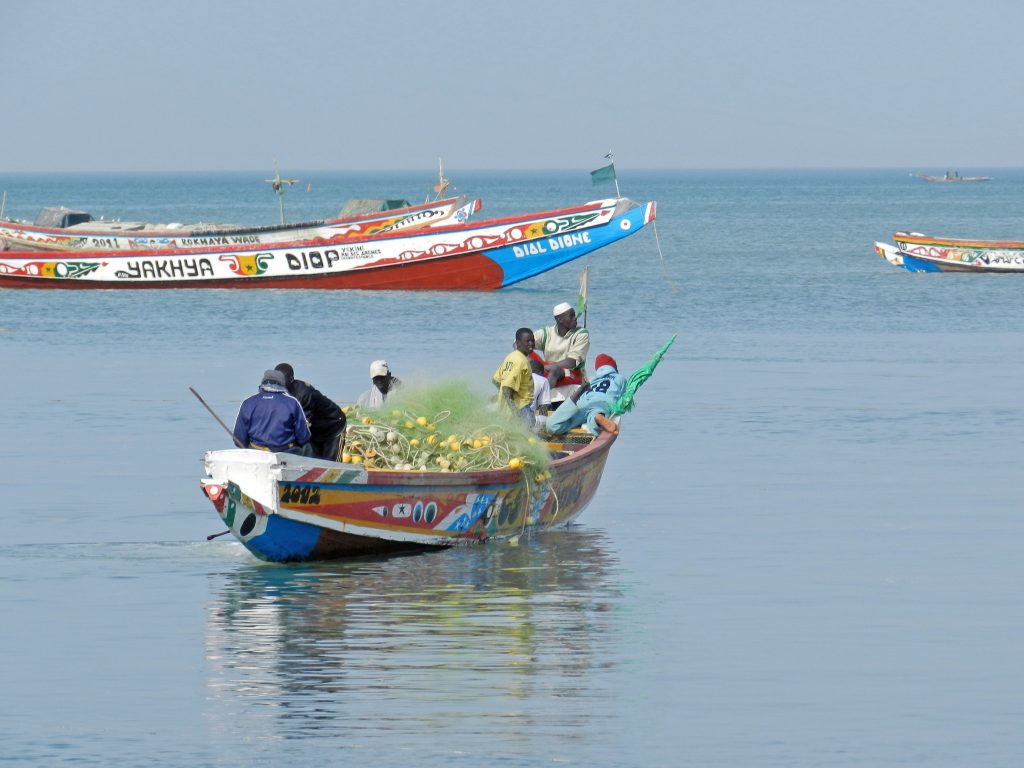 Fishermen in a canoe going to sea