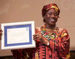 Fatou holding up the Equator Prize in Rio