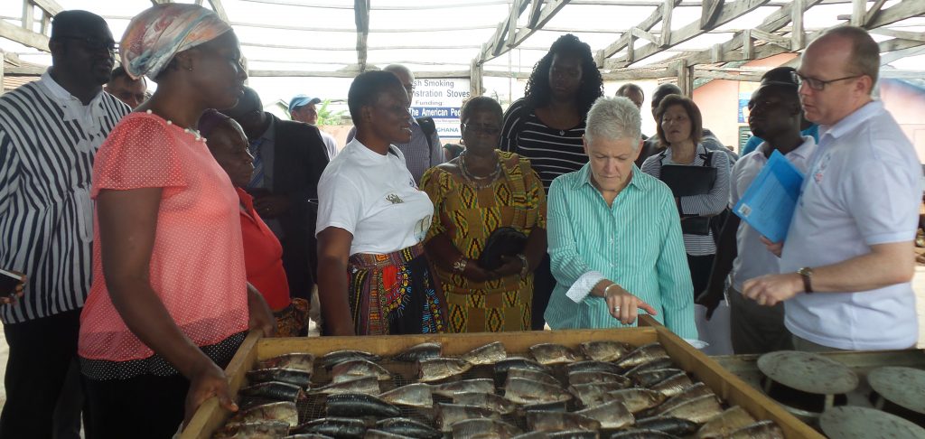 Administrator Gina McCarthy observing the Ahotor fish demonstration stove 