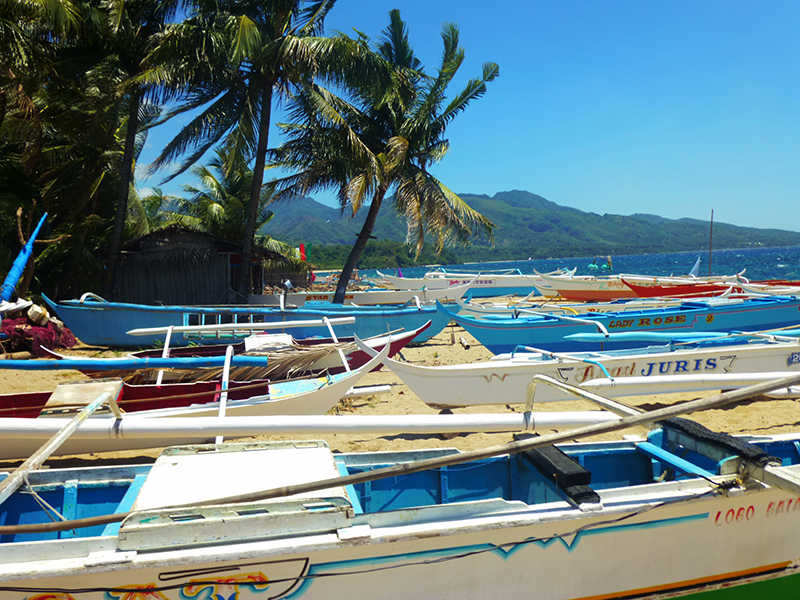 fishing canoes on a beach in the Philippines